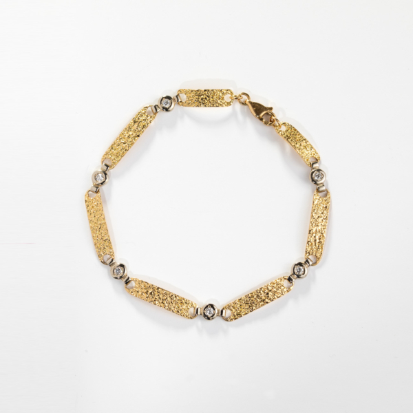 Bracelet OR Jaune et OR Blanc 750‰ enrichi de 6 diamants en serti clos